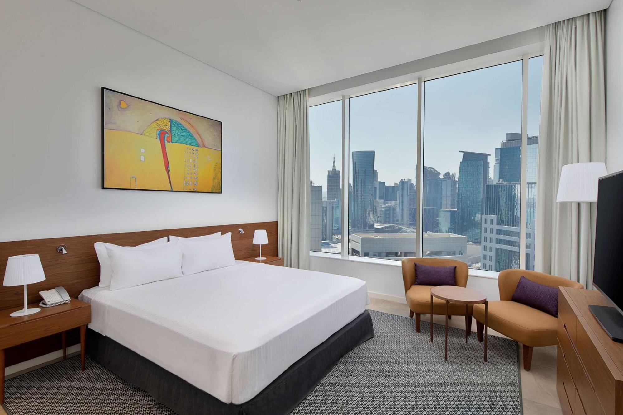 Aleph Doha Residences, Curio Collection By Hilton Εξωτερικό φωτογραφία A bedroom at the hotel