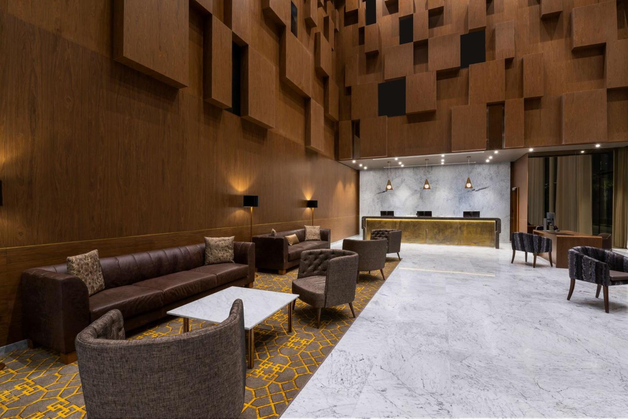 Aleph Doha Residences, Curio Collection By Hilton Εξωτερικό φωτογραφία The lobby of the hotel
