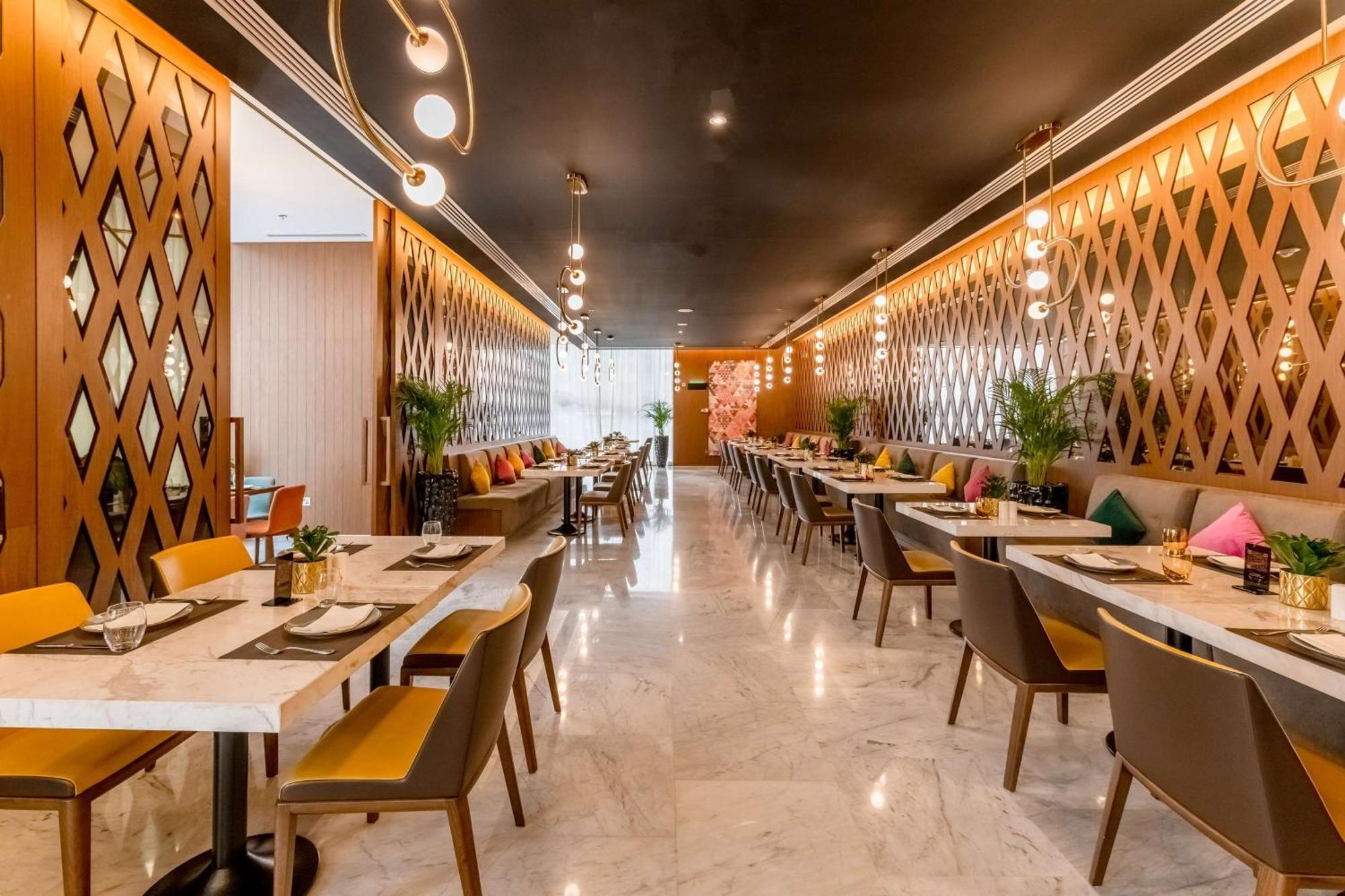 Aleph Doha Residences, Curio Collection By Hilton Εξωτερικό φωτογραφία The interior of the restaurant
